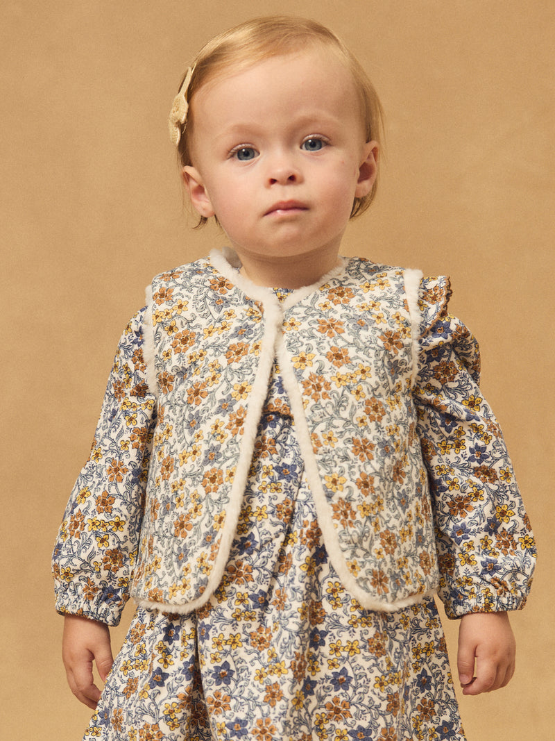 Gilet reversível branco de pele ou estampado floral para menina