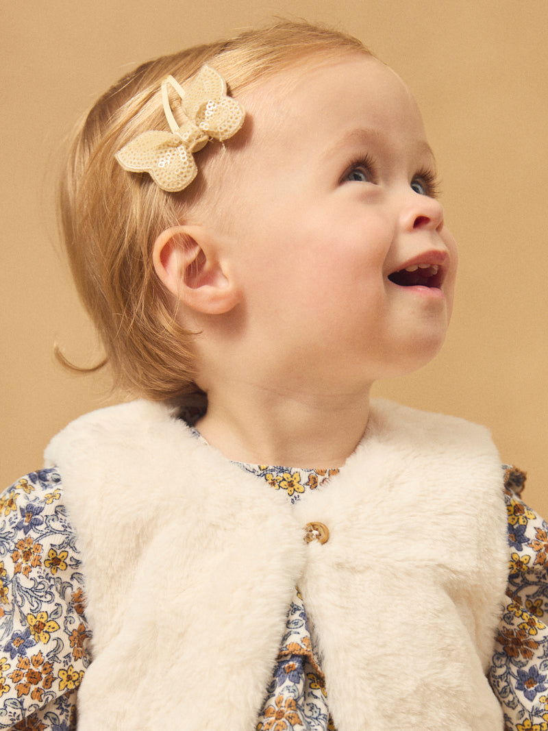 Gilet reversível branco de pele ou estampado floral para menina