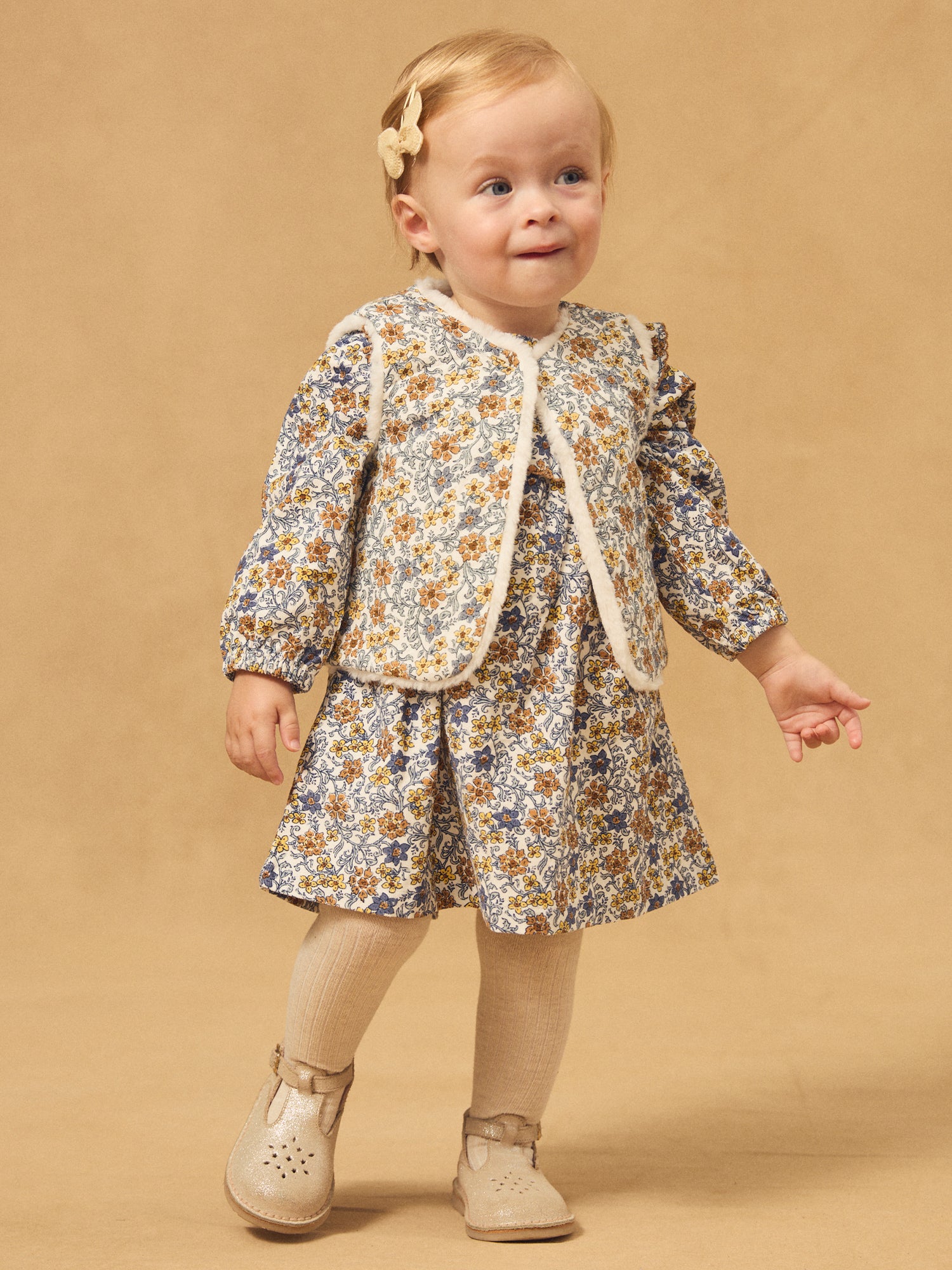 Gilet reversível branco de pele ou estampado floral para menina