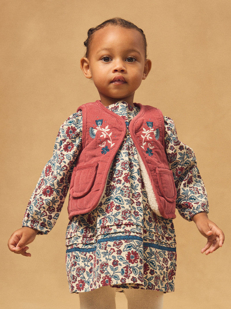Cardigan sem mangas reversível em vermelho ou ecru para menina