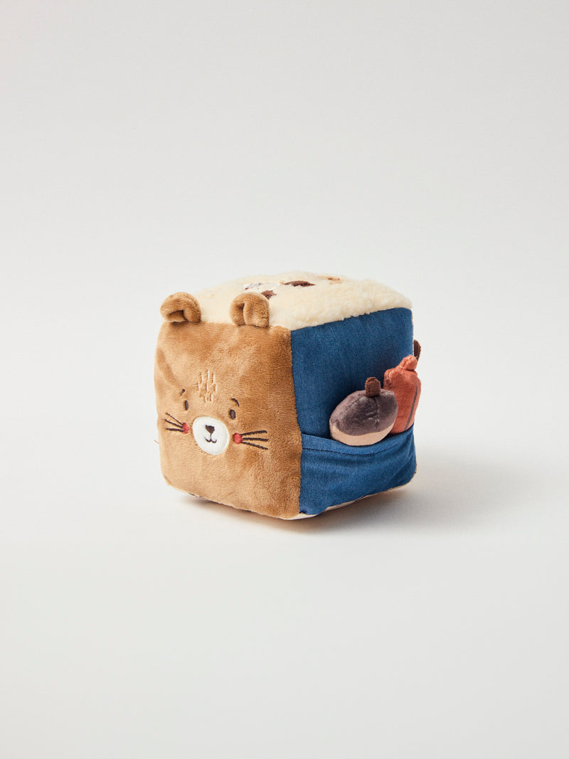 Cubo de atividades castanho em multitextura