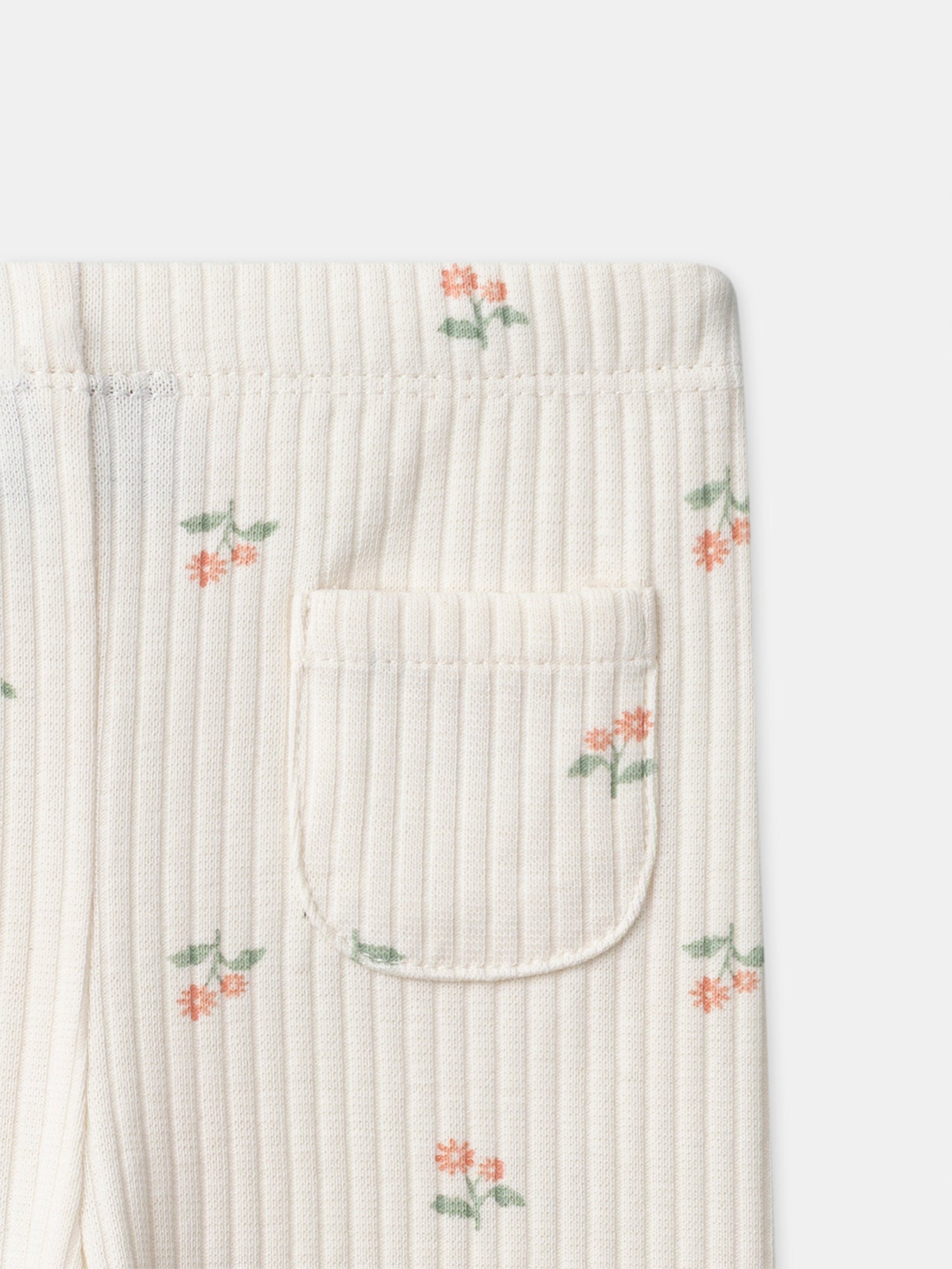 Leggings em marfim com estampado floral para bebé menina