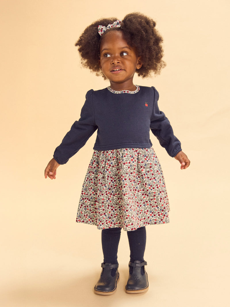 Vestido bimaterial com parte de cima azul-marinho e parte de baixo com impressão de bagas Bebé Menina