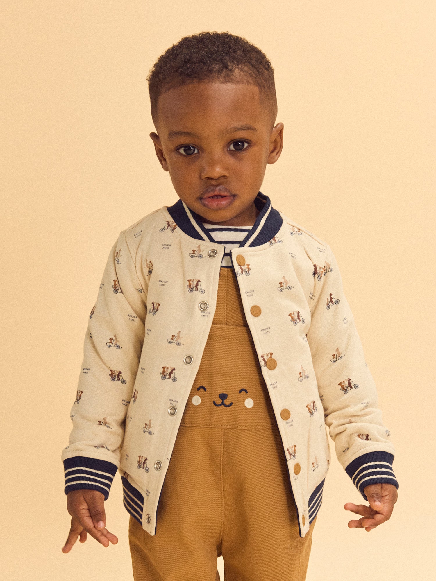 Teddy reversível azul marinho ou creme estampado com cães bebé rapaz
