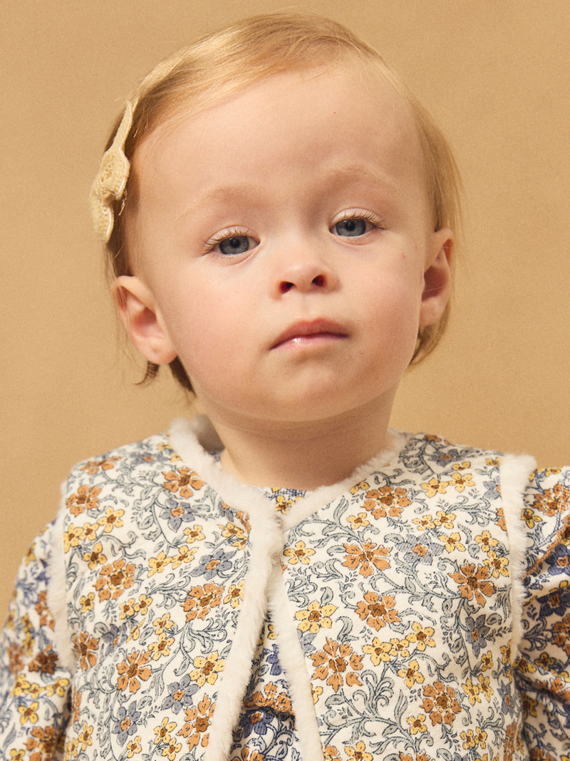 Gilet reversível branco de pele ou estampado floral para menina