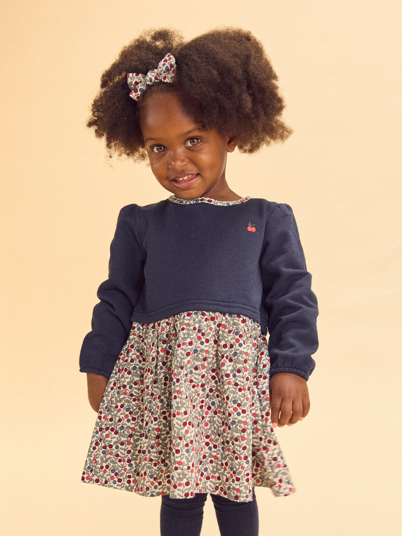 Vestido bimaterial com parte de cima azul-marinho e parte de baixo com impressão de bagas Bebé Menina