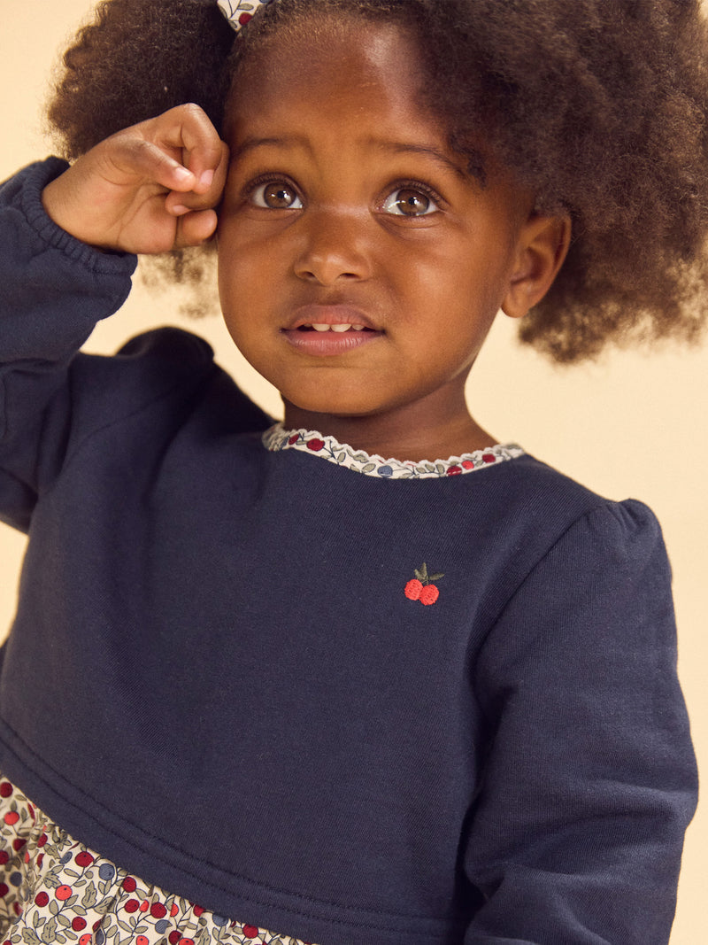 Vestido bimaterial com parte de cima azul-marinho e parte de baixo com impressão de bagas Bebé Menina