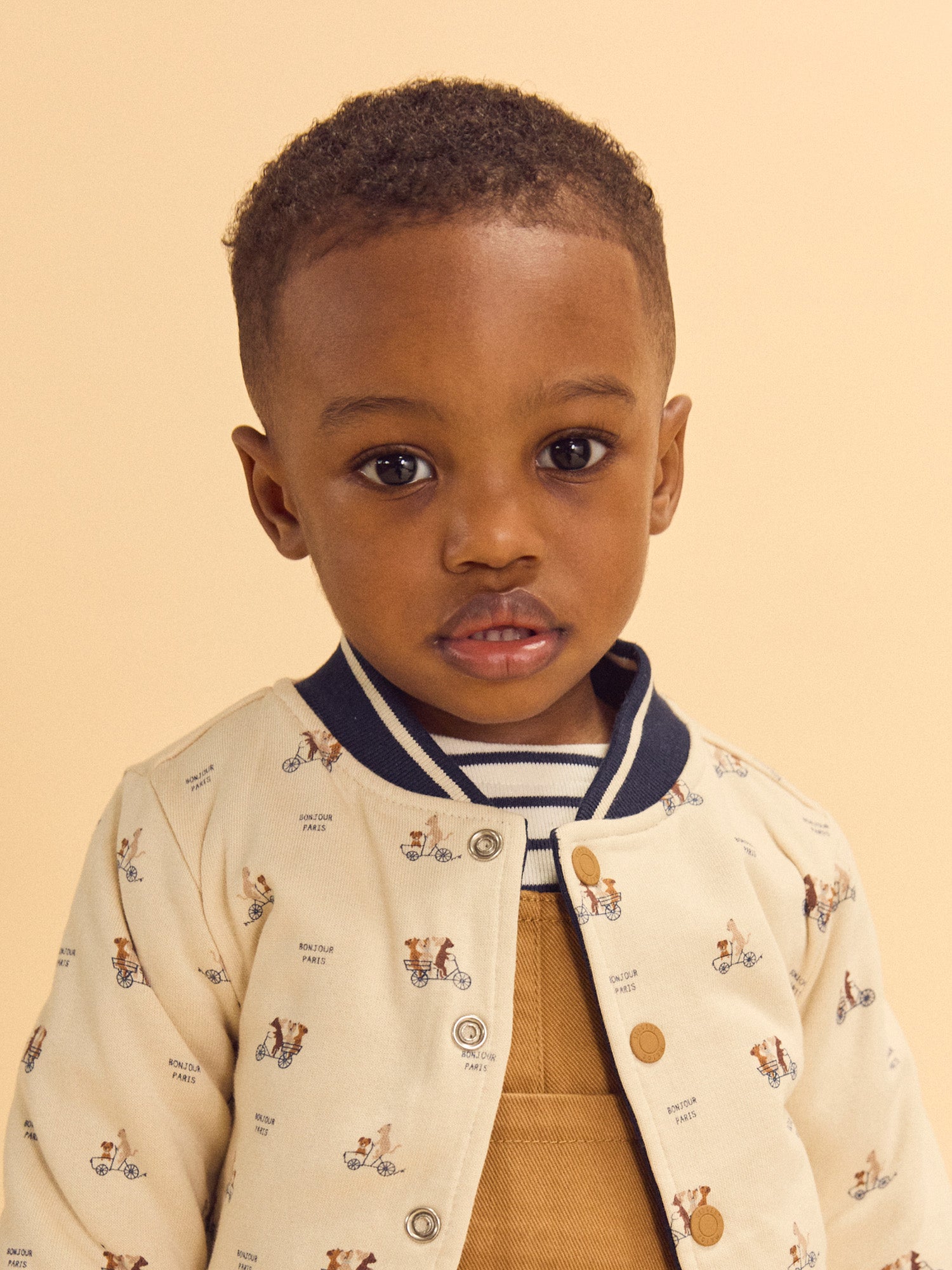 Teddy reversível azul marinho ou creme estampado com cães bebé rapaz