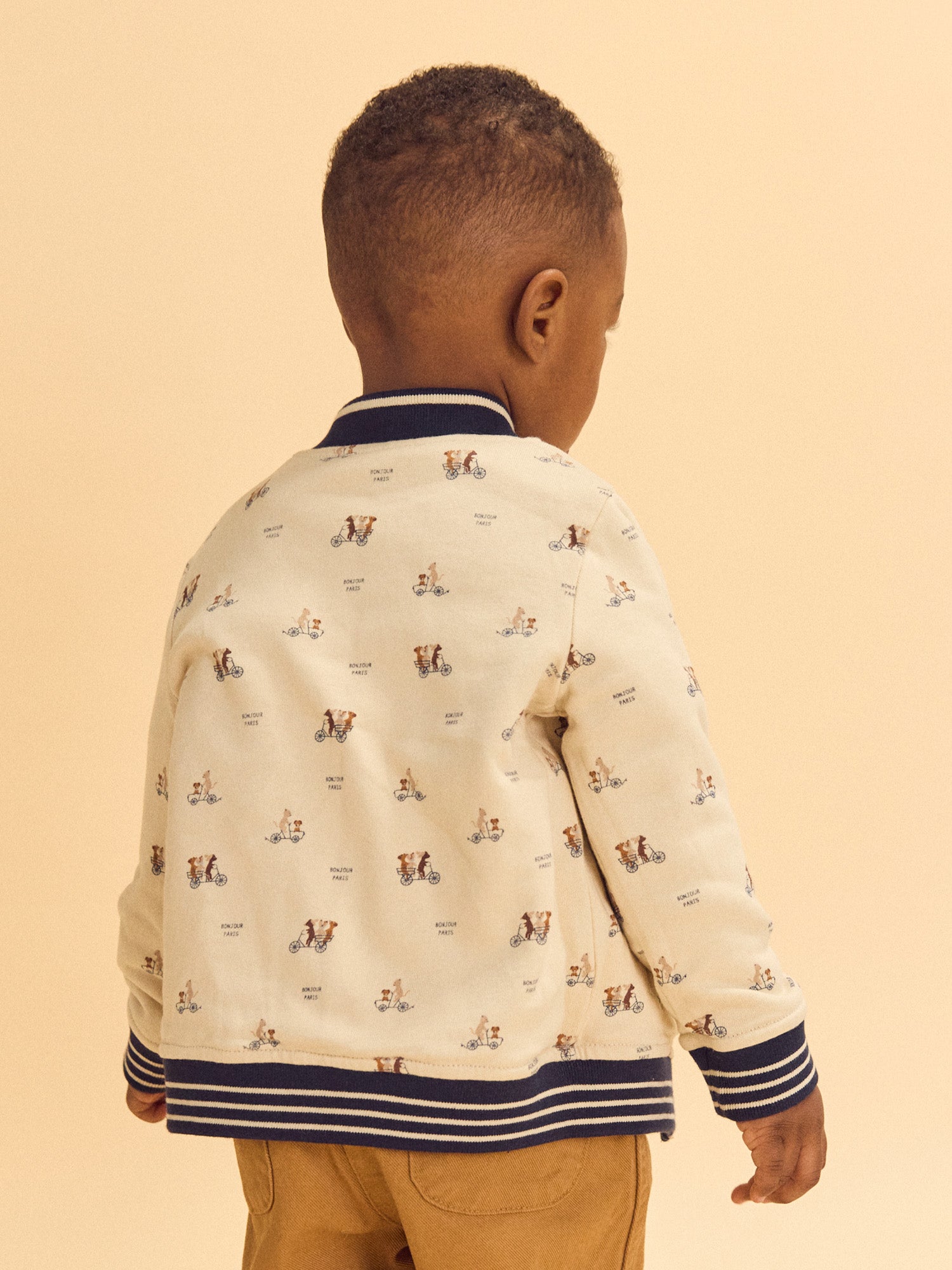 Teddy reversível azul marinho ou creme estampado com cães bebé rapaz
