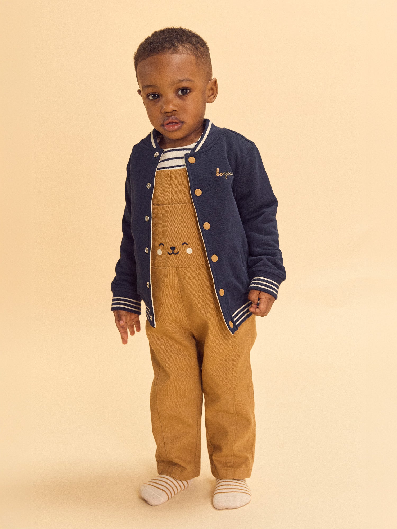 Teddy reversível azul marinho ou creme estampado com cães bebé rapaz